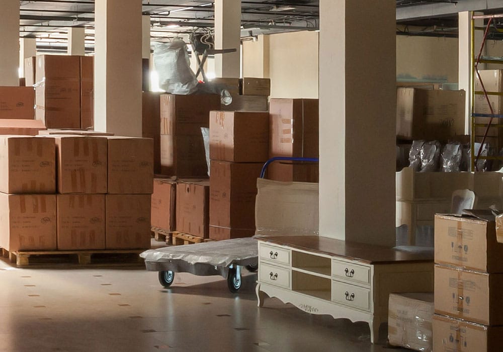 Moving boxes and fine furniture in storage unit