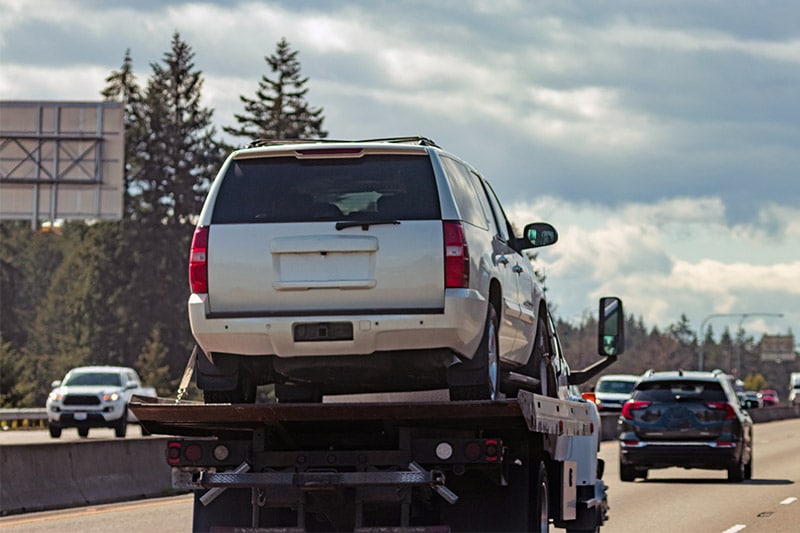 Transporting vehicle inside trailer